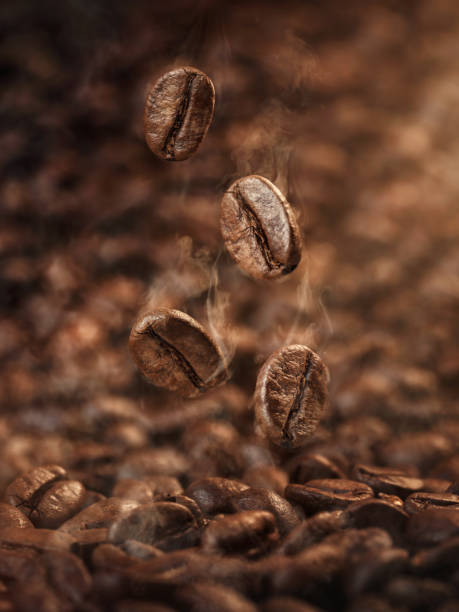 Roasting Tanzania coffee falling roasted beans